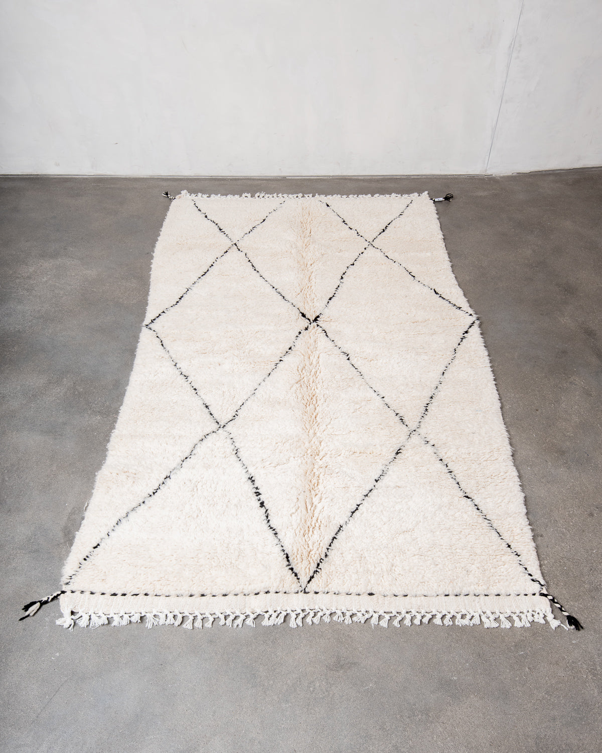 Modern, designer, handcrafted Berber rug from Morocco. Beniourain carpet with minimalist design, natural wool pile and a fluffy texture.